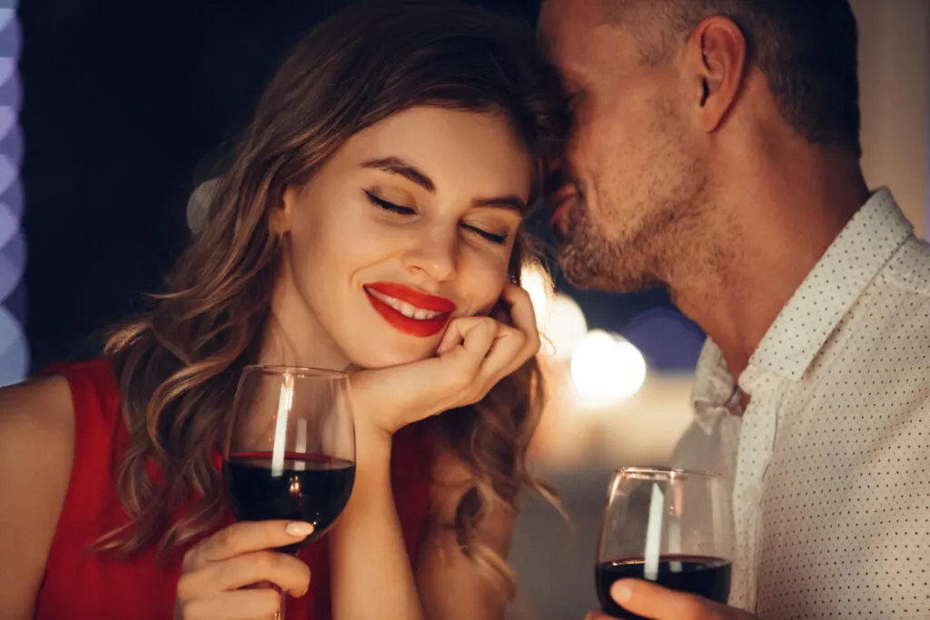 two people enjoying wine on a romantic connecticut getaway.