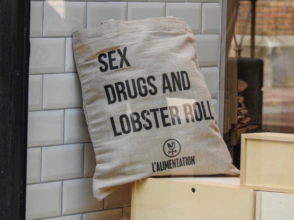 image of bag that says sex, drugs, and lobster rolls.
