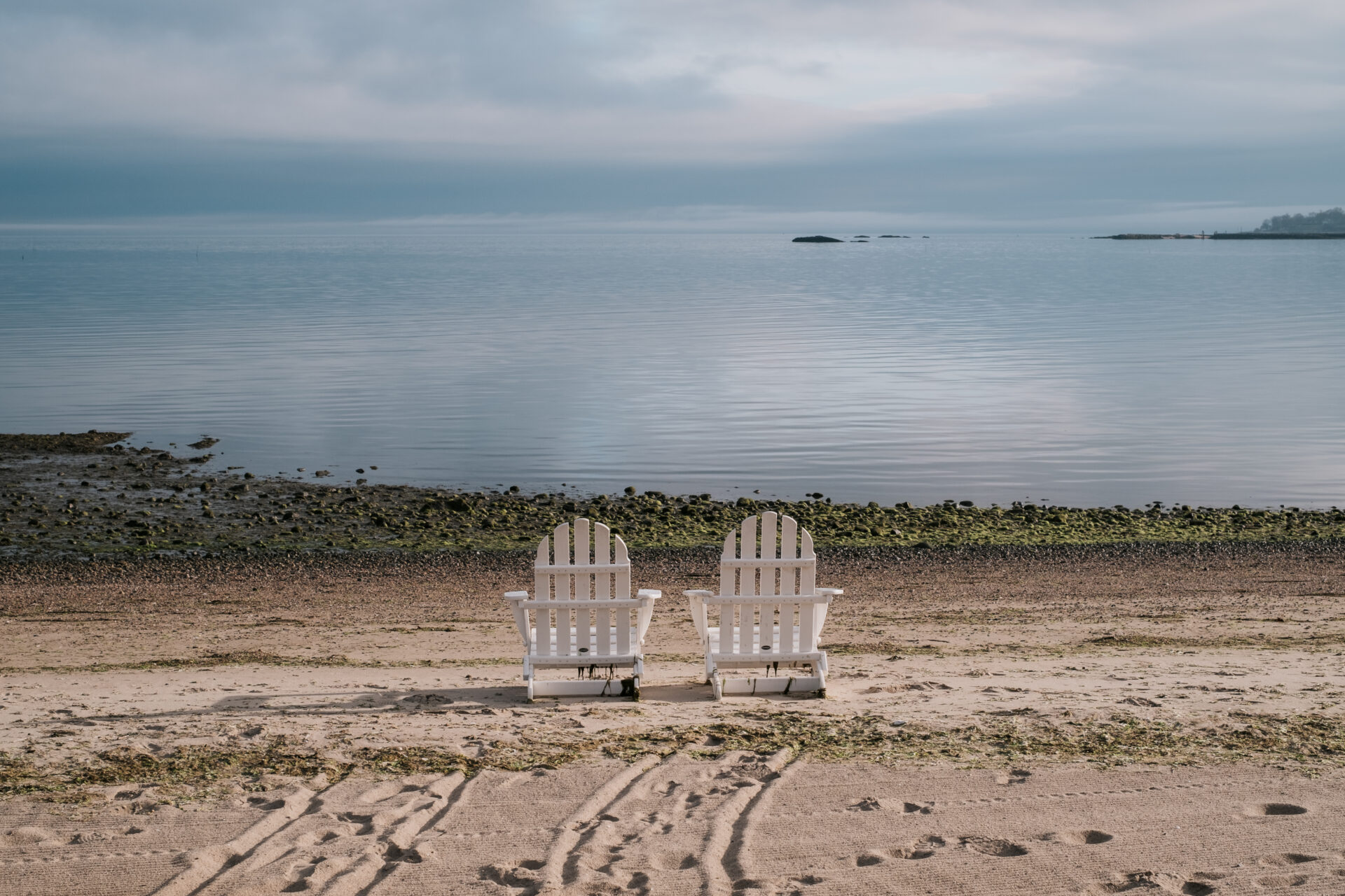 image of 2 chairs on the beach in resorts in Connecticut.