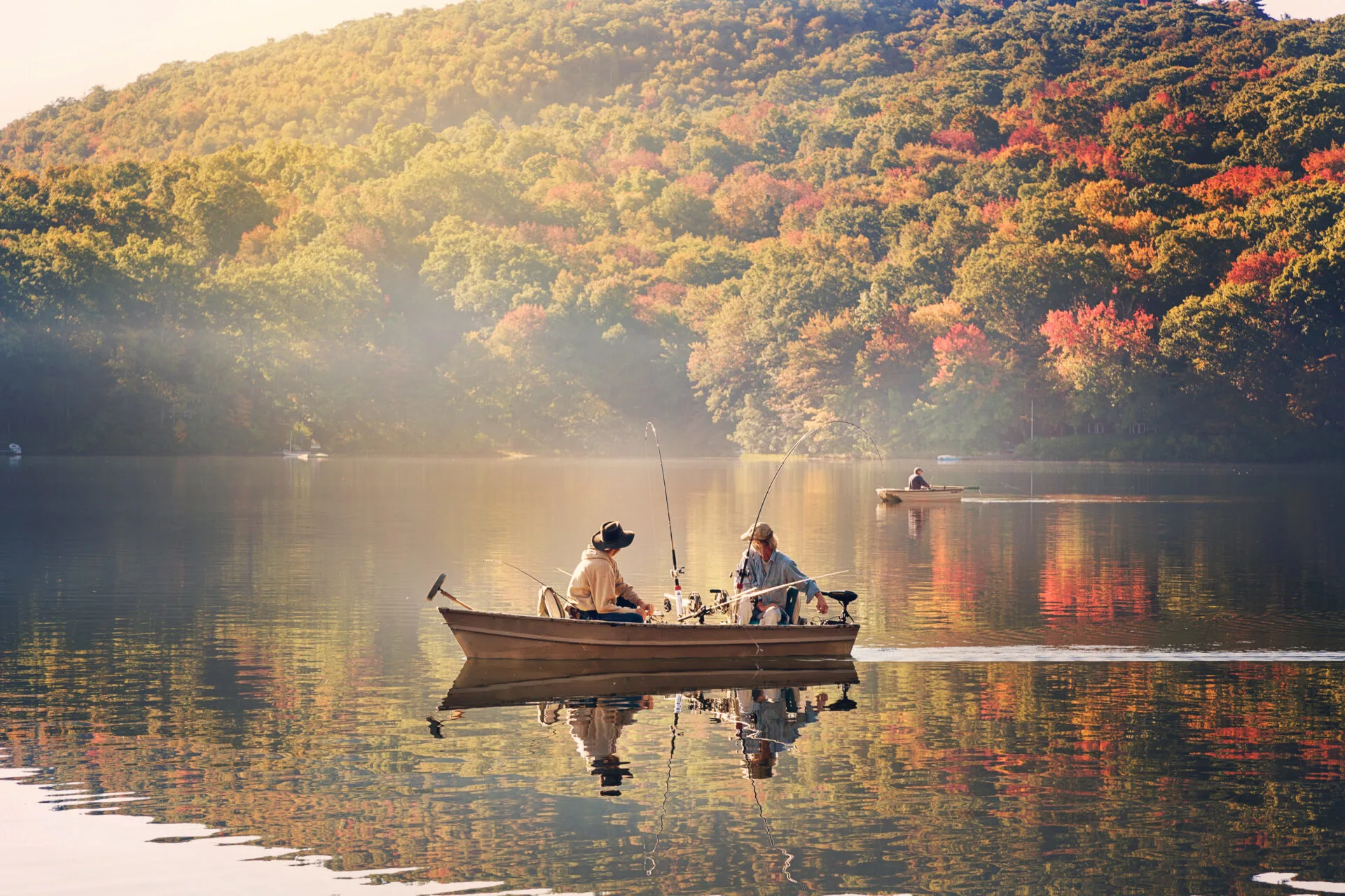 image of people on boat in lake fishing in Connecticut.