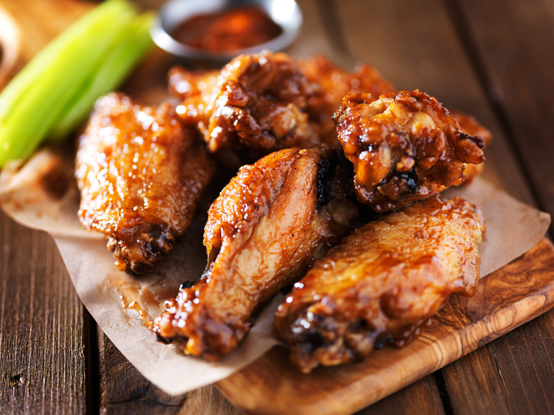 image of chicken wings on a plate with celery.