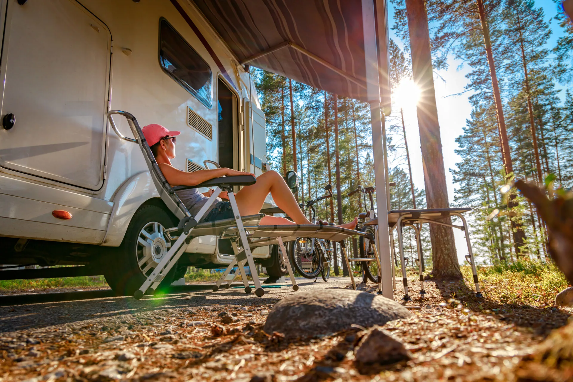 image of woman in chair near rv at campgrounds near hartford, ct.
