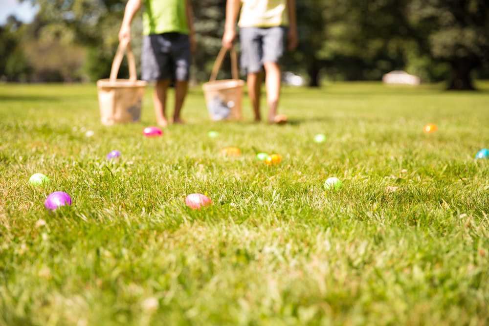 Image of 2 children walking in grass for easter activities in connecticut.