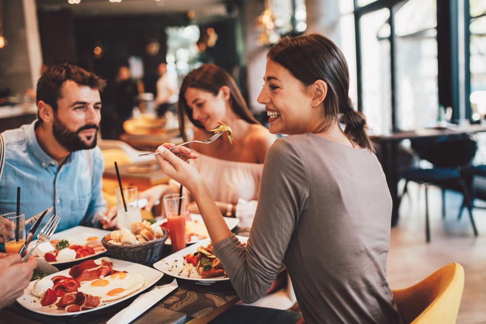 Image of 3 people enjoying breakfast in New Haven, CT restaurant.