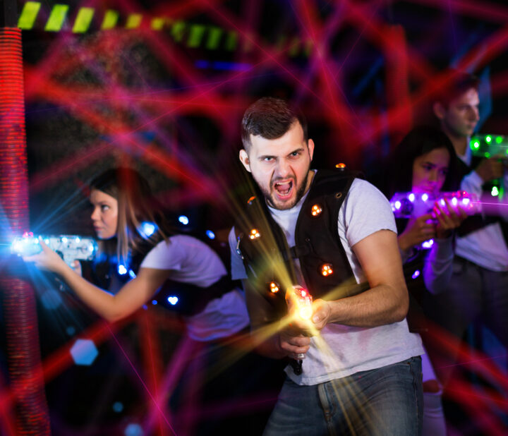 image of excited man playing laser tag in CT.