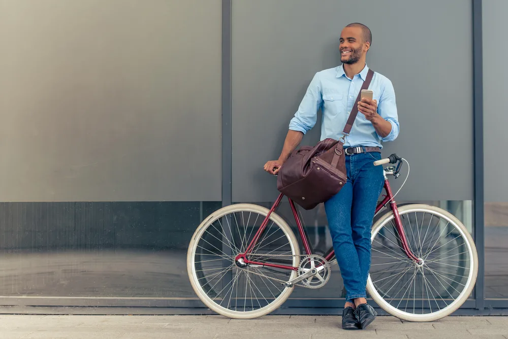 image of a man going to work on a bike. Answering the question can you live in Connecticut without a car?