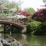 image of bridge over river at one of the Connecticut botanical gardens.
