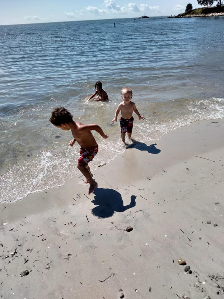 Image of children playing at hole in the wall beach in niantic ct.