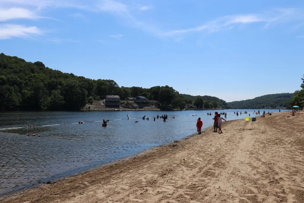 Image of people swimming at the beach in Indian Well State Park in Shelton, CT.