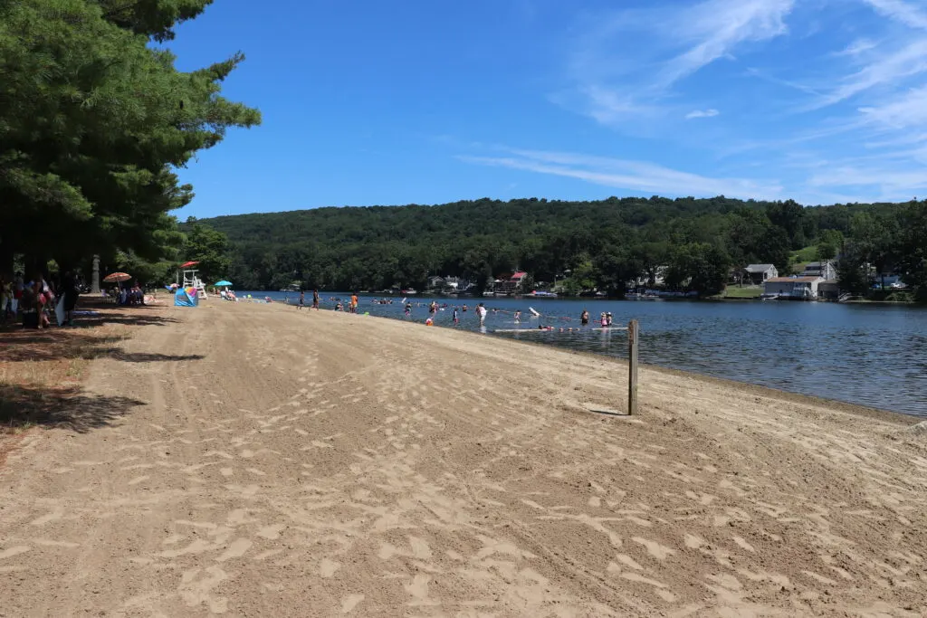 Image of people swimming at the beach in Indian Well State Park in Shelton, CT.
