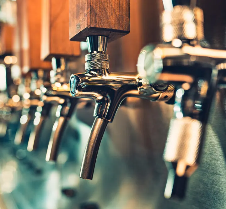 Image of beer taps at breweries in New Haven, CT.