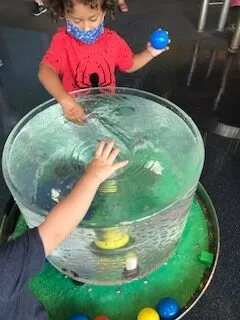 image of children playing in water at the connecticut science center.