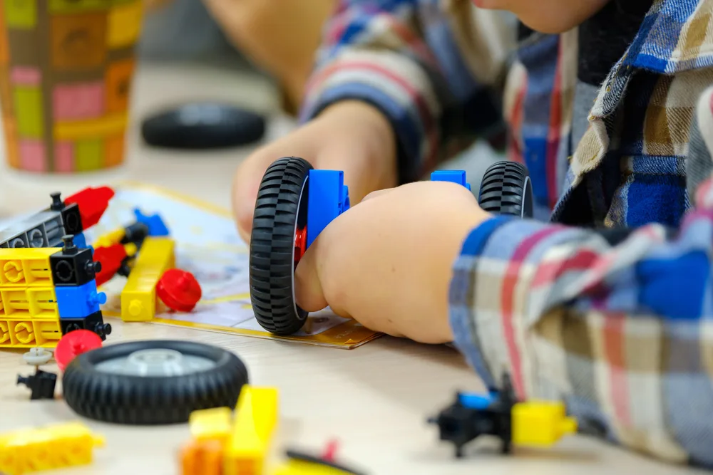image of child playing with legos at one of the children's museums in CT.