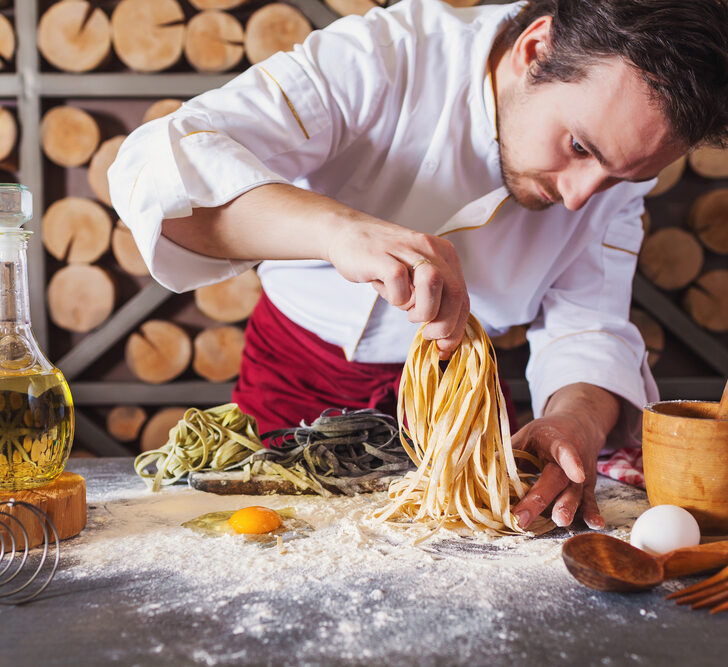 image of chef preparing pasta for a dish at one of the itailian restaurants in CT.
